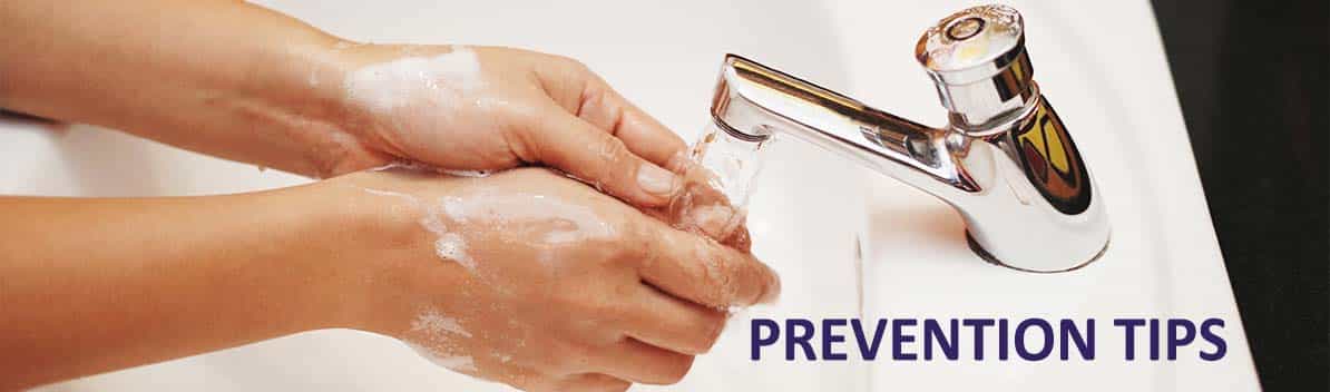 picture of someone washing their hands with the word prevention overlayed on it